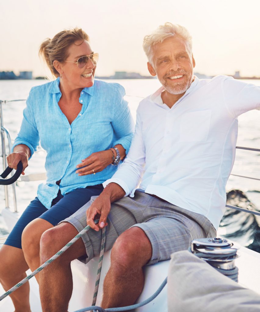 Happy older couple on a sail boat